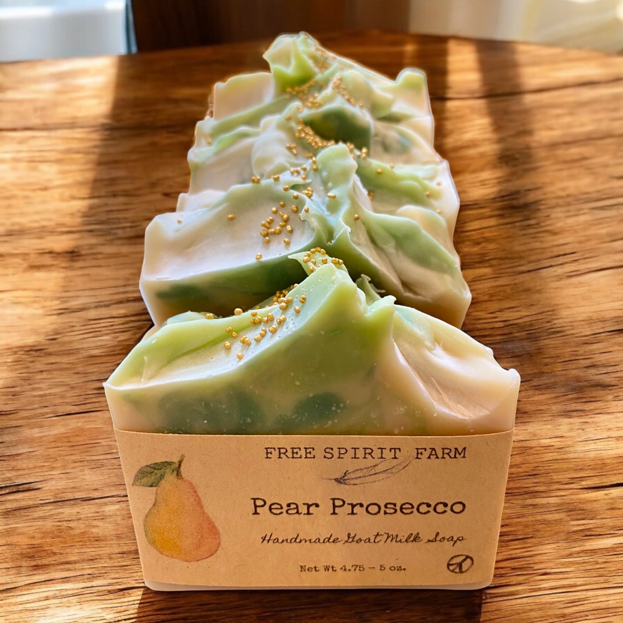 A bar of handmade goat milk soap labeled &