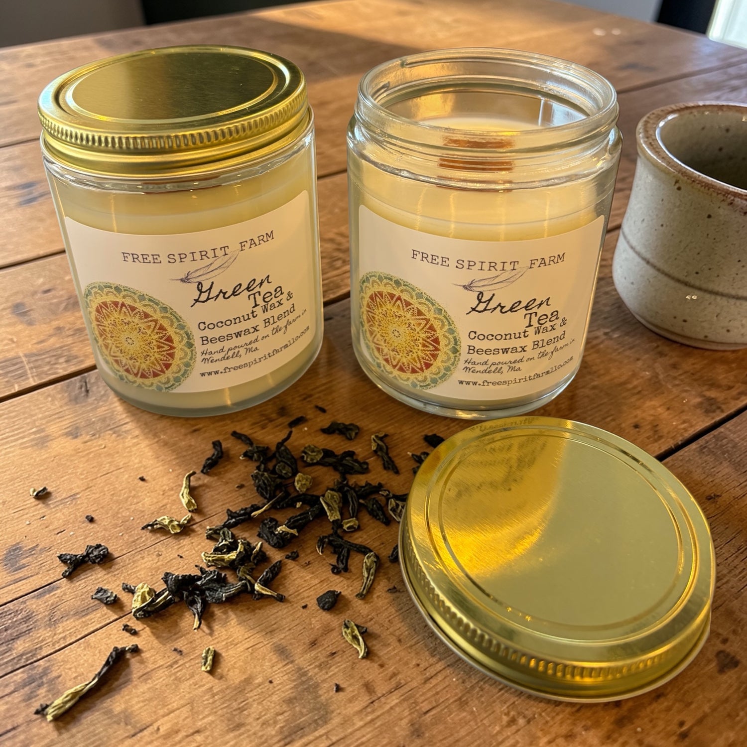 Two glass jars with gold lids labeled &