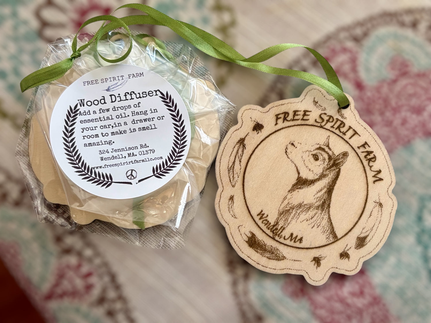 Wood diffuser with Free Spirit Farm label on a patterned background
