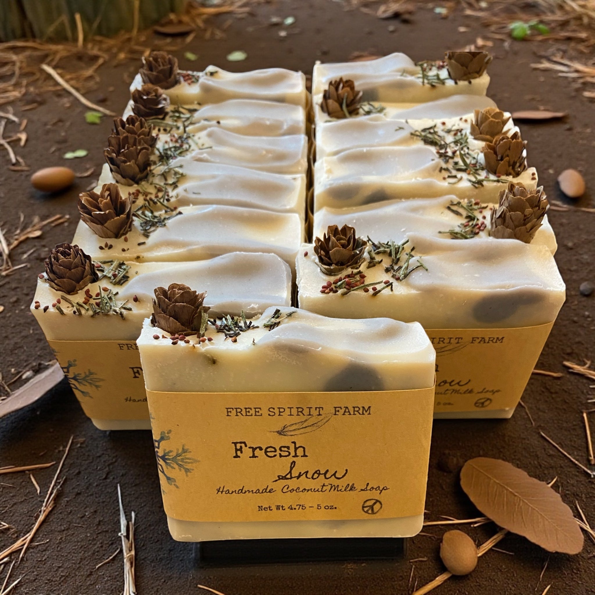 Handmade soap bars with natural elements on a rustic background