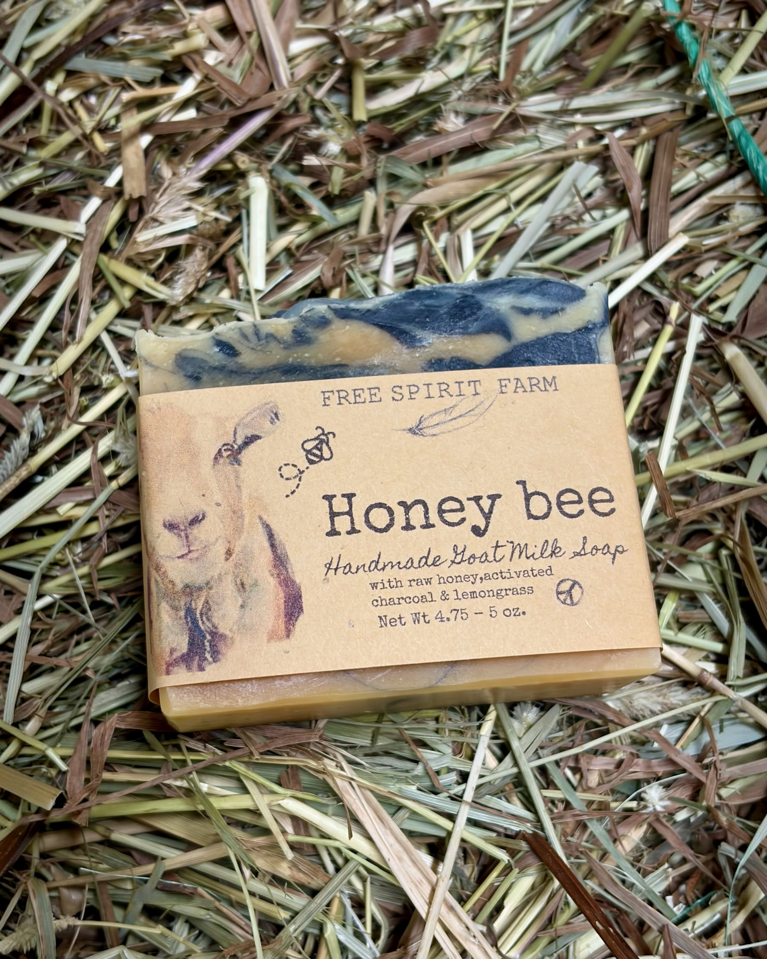Handmade soap bar from Free Spirit Farm on a bed of straw