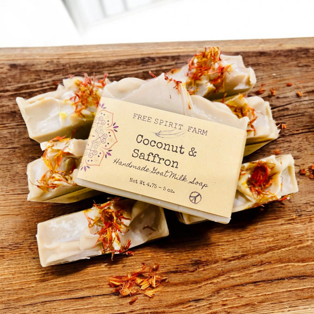 Handmade soap bars with a label on a wooden surface