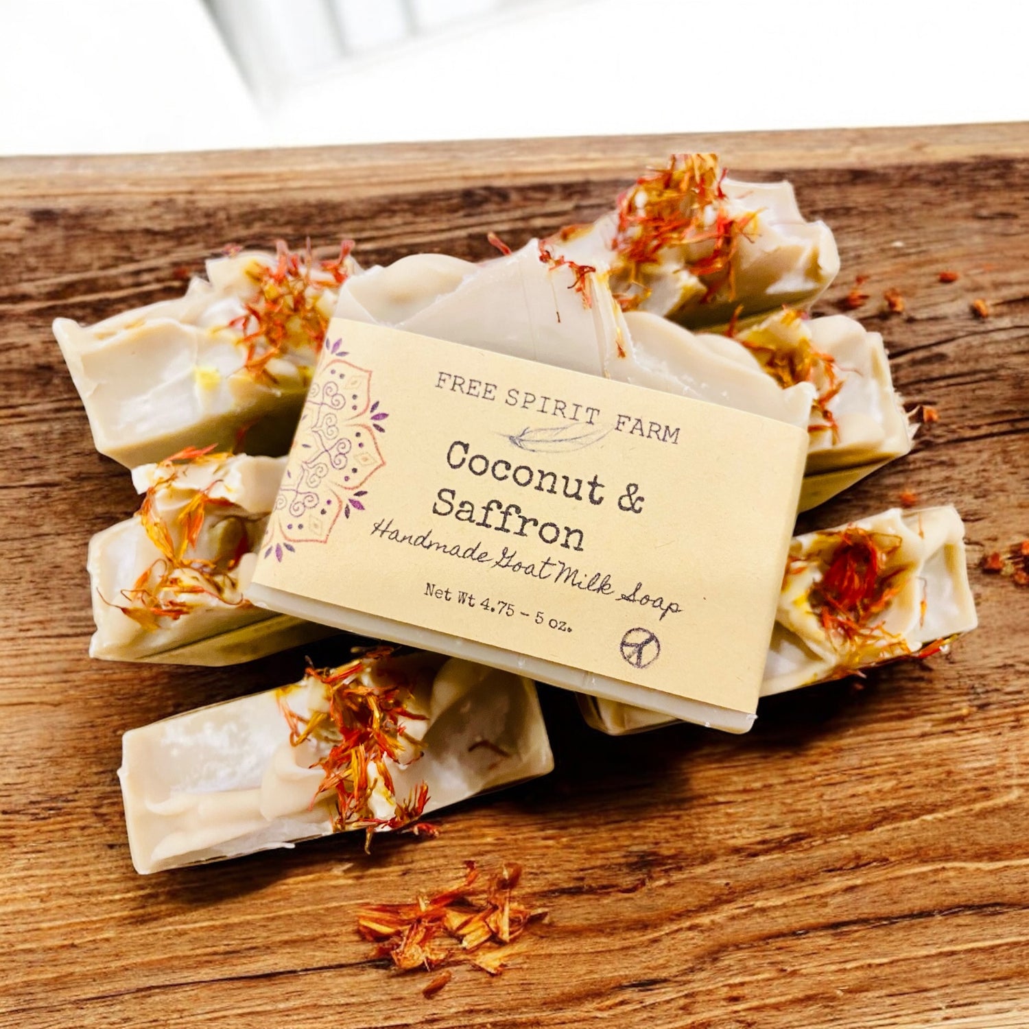 Handmade soap bars with a label on a wooden surface