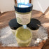 A container of Foaming Sugar Scrub with a label that reads &