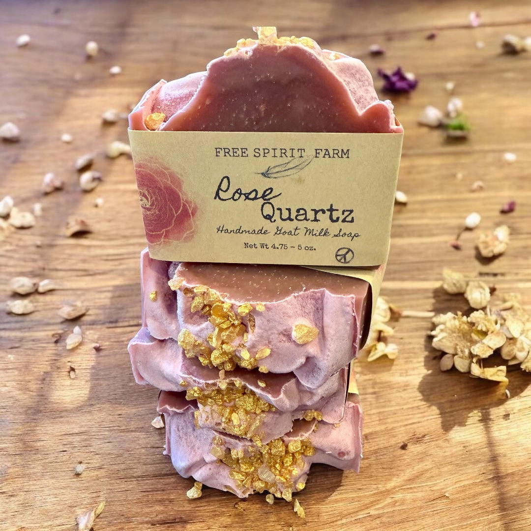 Rose Quartz soap with gold on a wooden background, featuring Free Spirit Farm branding.