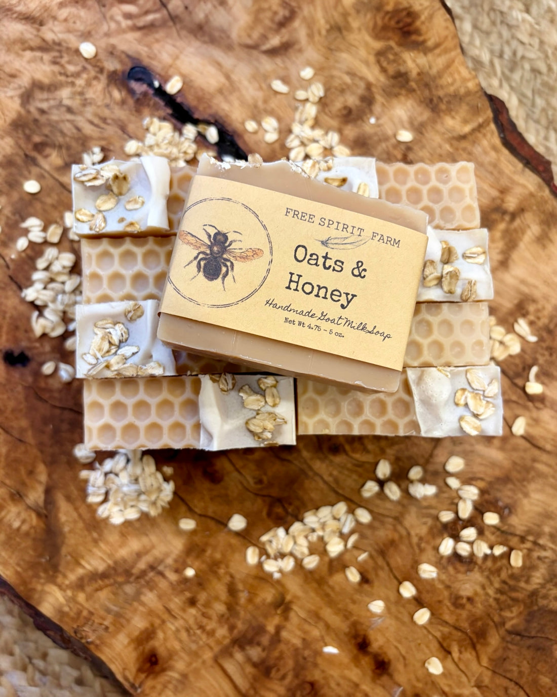 Oats &amp; Honey soap bars with a free spirit farm label on a wooden surface